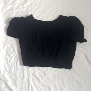 Black crop top with small puffed sleeves.